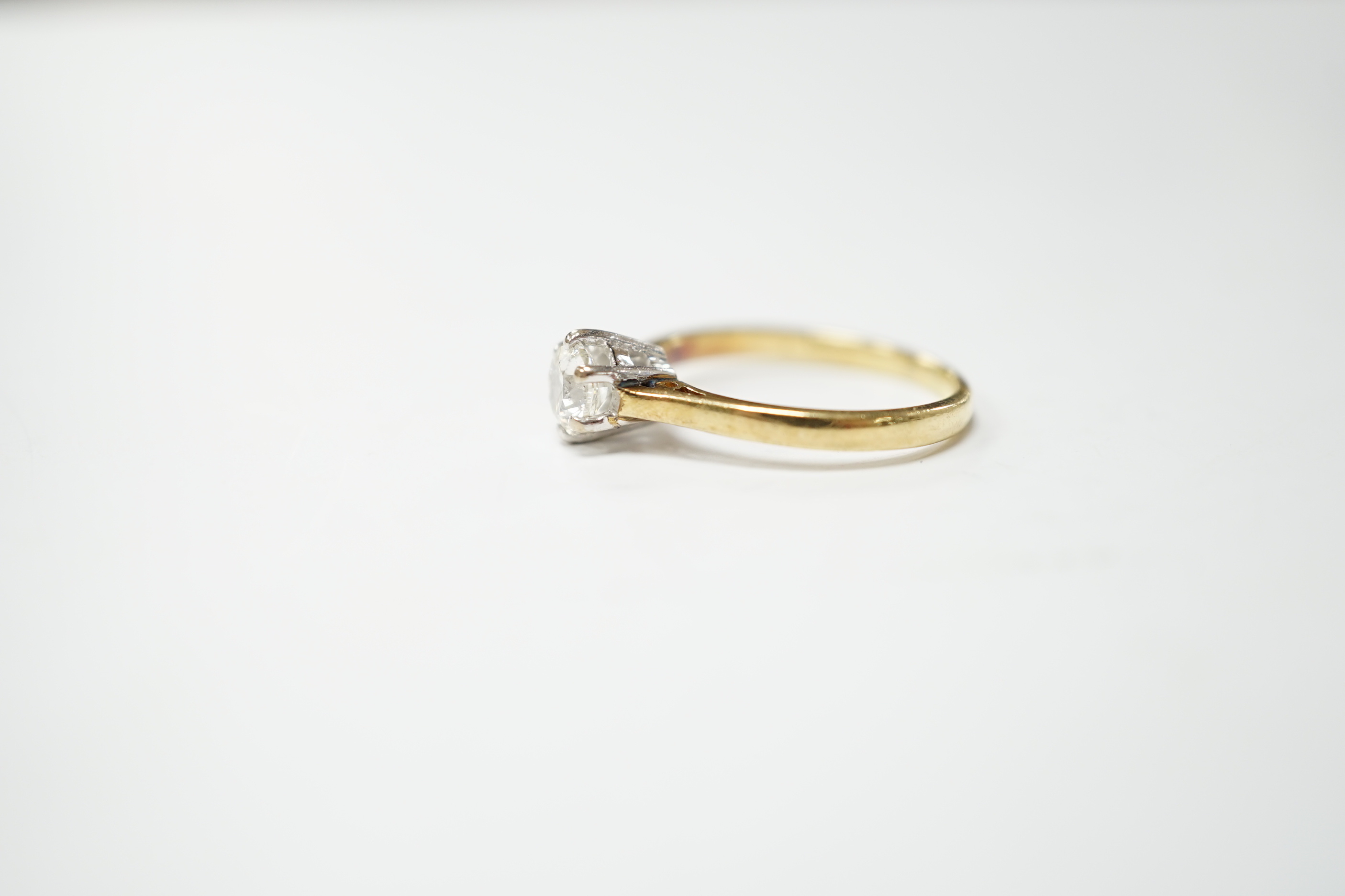 A modern 18ct gold and solitaire set diamond ring, the stone weighing 0.50ct, gross weight 2.2 grams.
